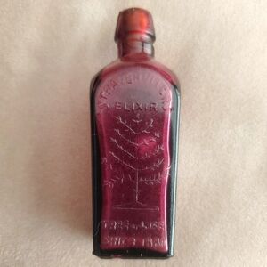 Straubhullers Elixir Tree Of Life Ruby Glass Bottle